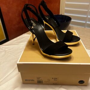 Sexy!  Black Michael Kors black strappy with gold heel!